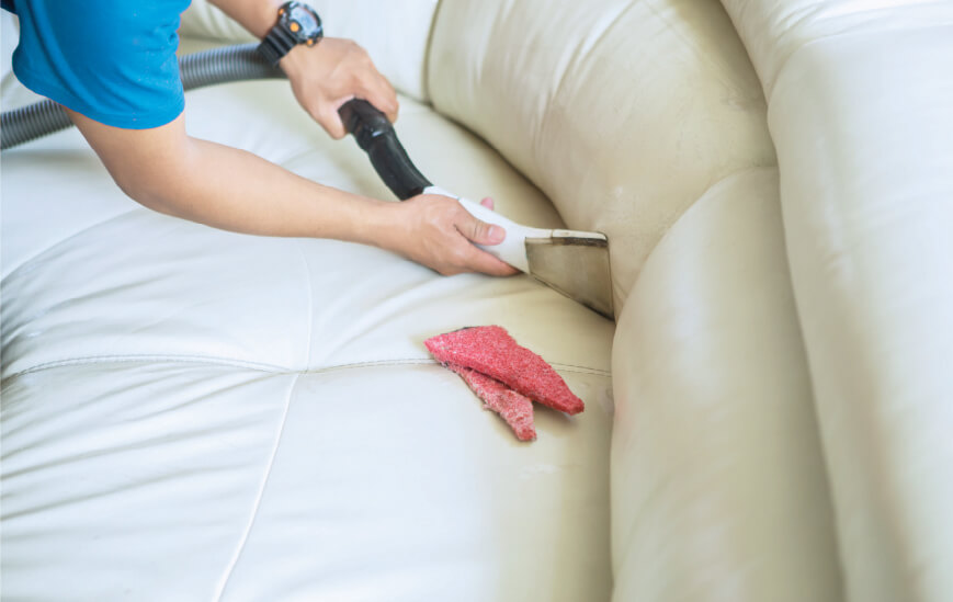 Leather sofa cleaner sweeping up deep corners for stain and spill removal