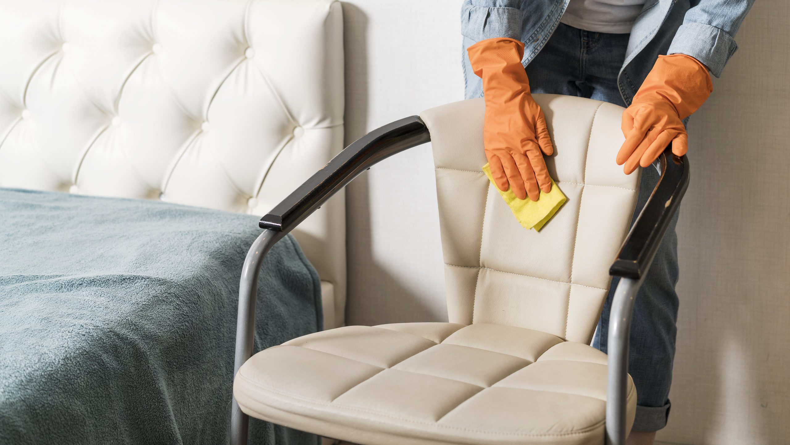 front-view-woman-cleaning-chair-min