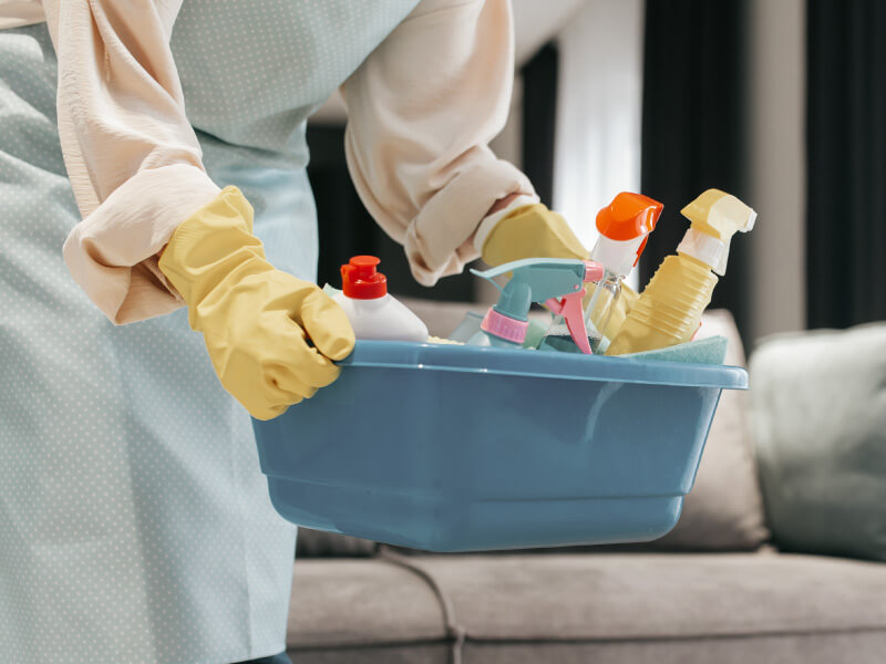Household cleaner preparing equipment for professional cleaning services