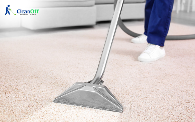 Dirt being removed from carpet by a vacuum cleaner