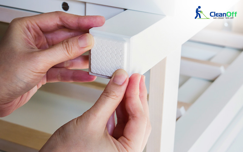 Putting a protective sticker onto furniture legs