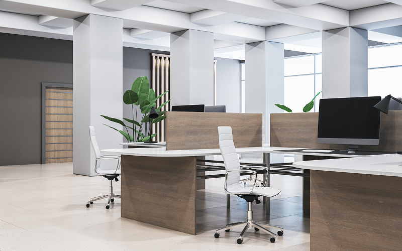 Spacious modern office with clean desks and white chairs.